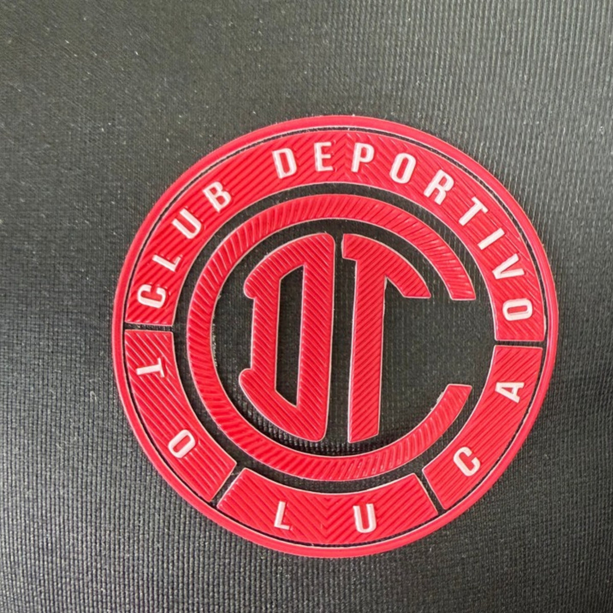 Toluca 2026 Tercera Edición Jugador - detalle escudo